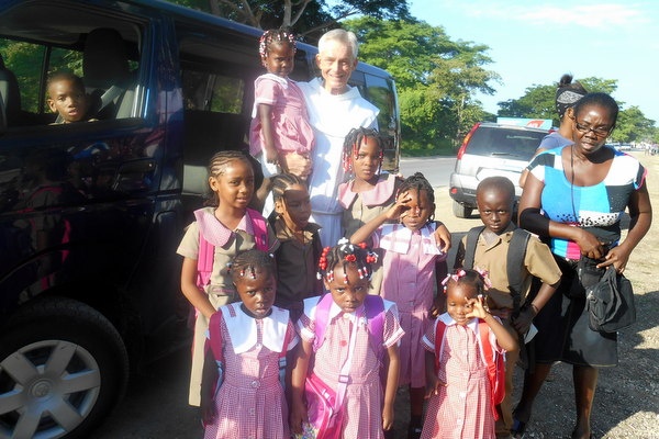All dolled up in pink school uniforms.