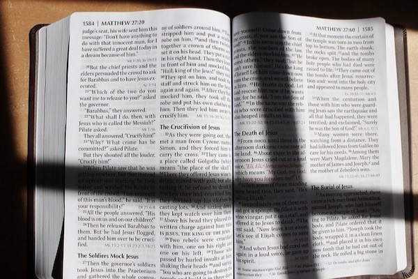 cross shadow on Bible