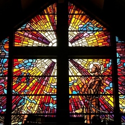 colorful window with cross and francis
